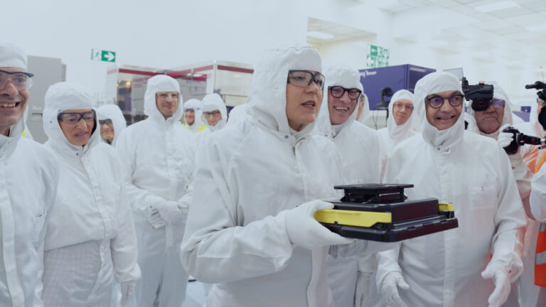 A group of people in lab suits