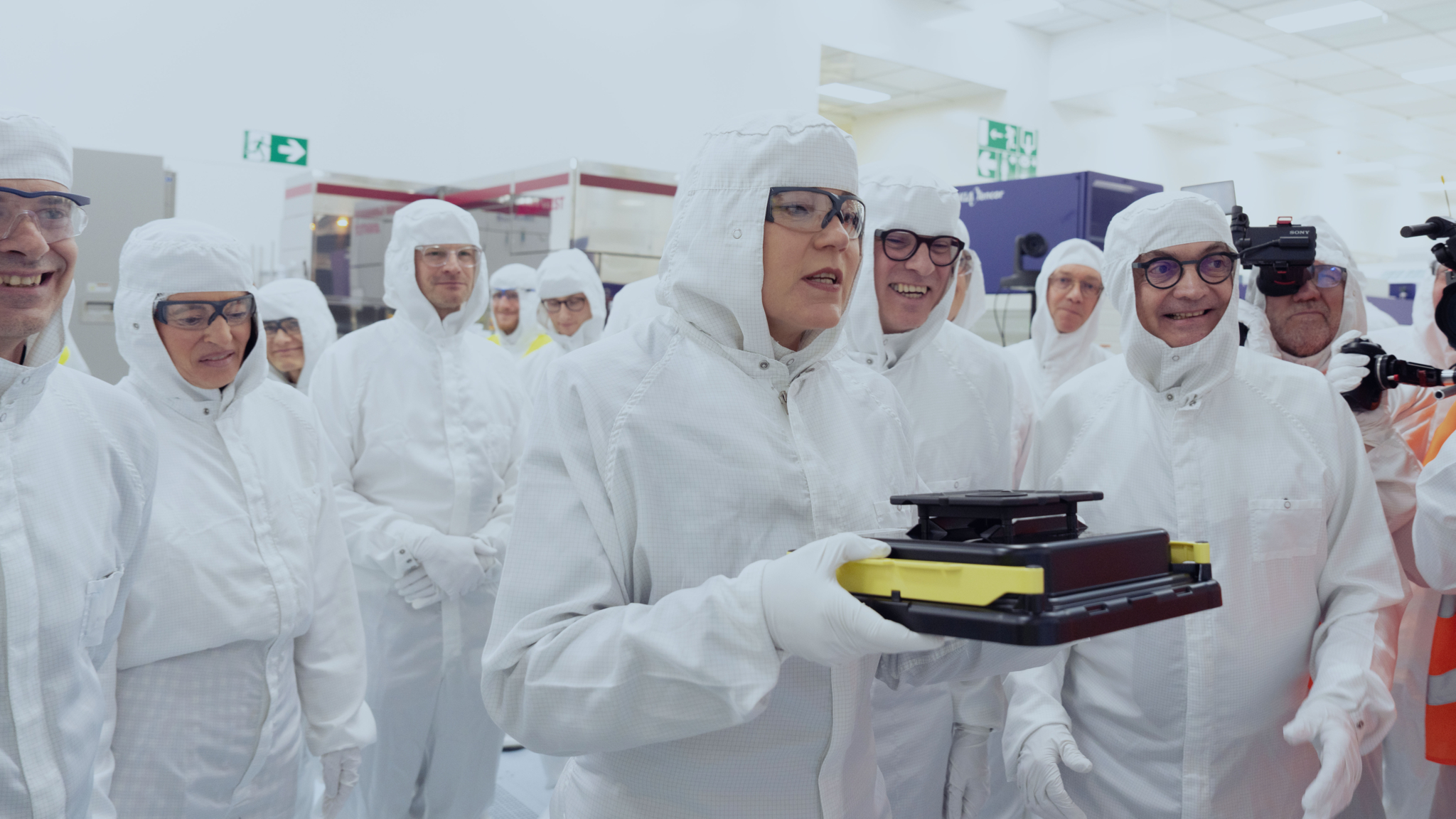 A group of people in lab suits