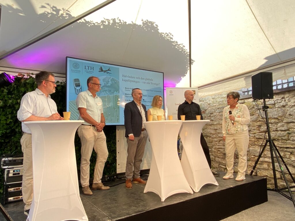 A panel of six persons at a booth in Almedalen